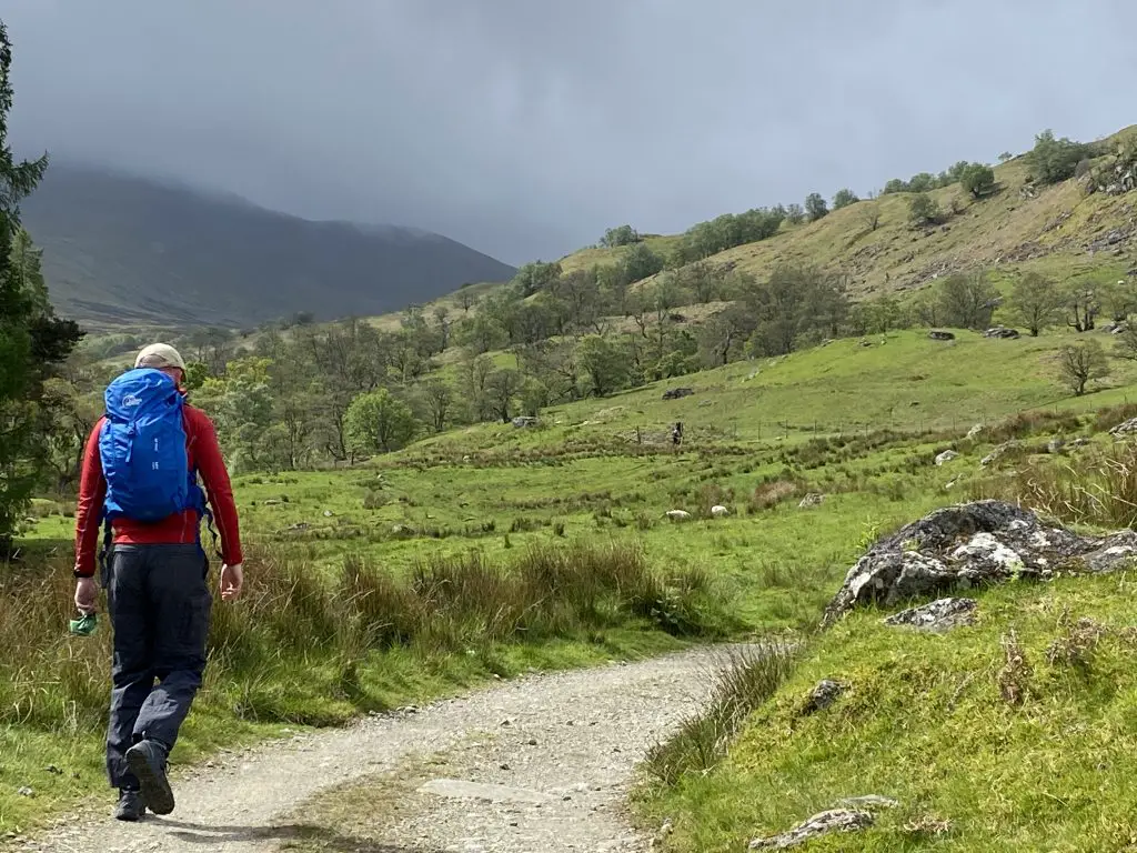 image of a man hiking hills